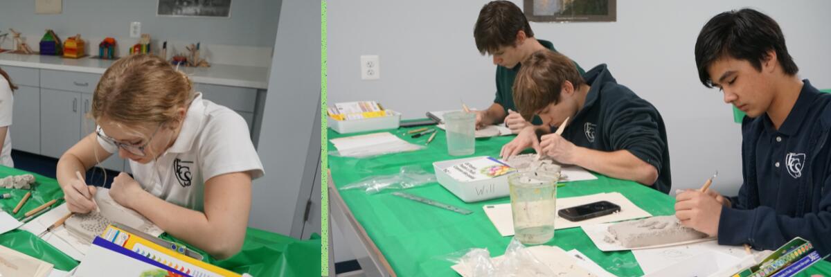 Students creating artwork in classroom